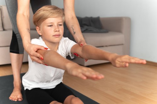 close-up-woman-helping-child-indoors.jpg